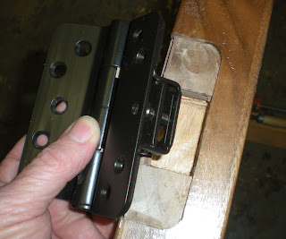 Adjustable hinges on hand carved walnut door