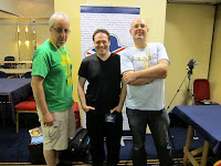 Mark Rivera, Chris Bowler & Michael Fox in front of the UK Gaming Media banner