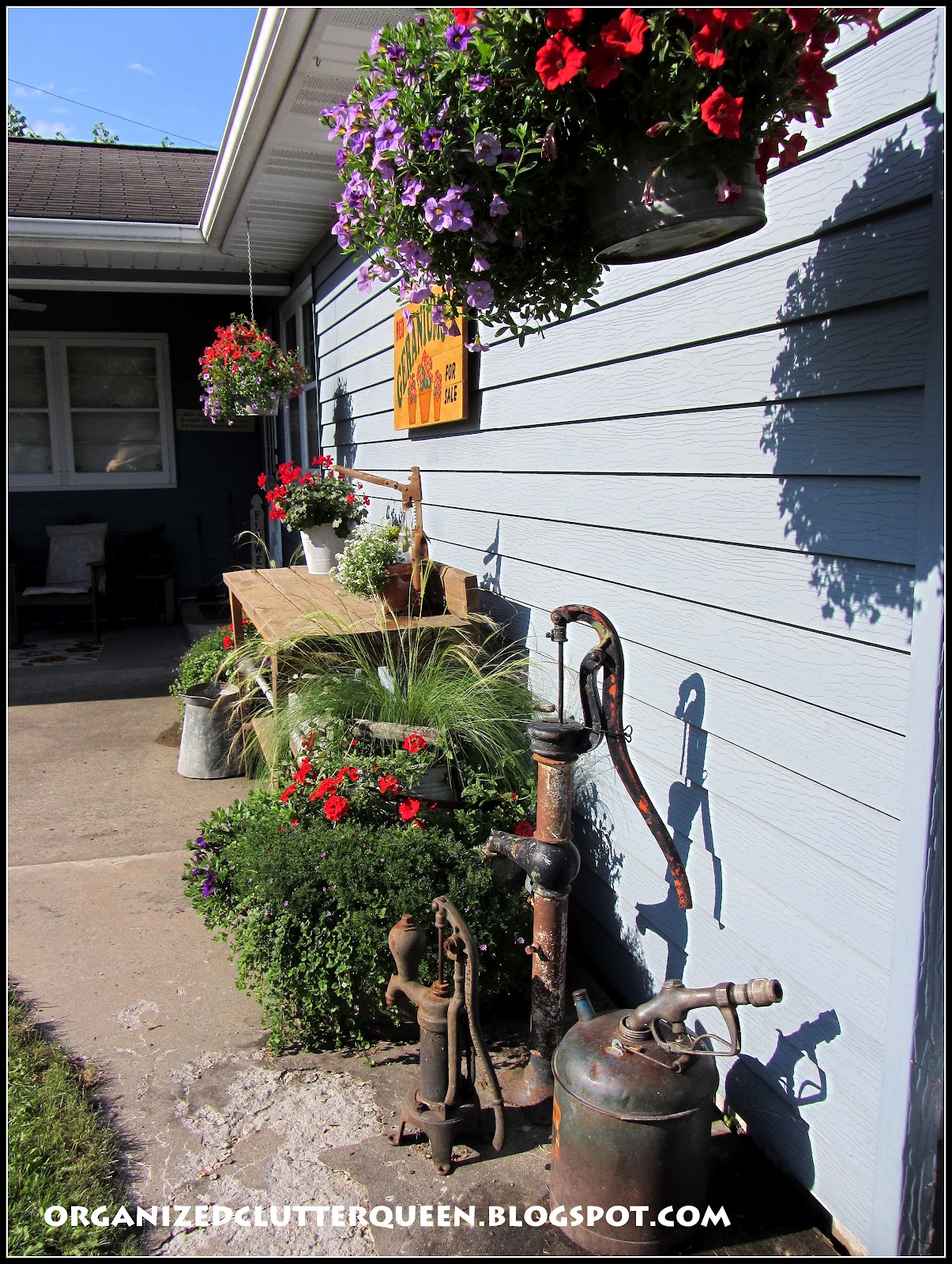 Potting Bench, Whiskey Barrels, and Hanging Pails Organized Clutter