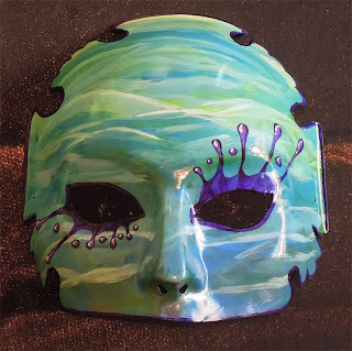 a hand painted mask representing Sister Water as the wet element being recognized in church this Sunday.