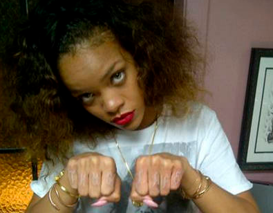 Rihanna's tattoo refers to the group name of rapper Tupac he had a tattoo on