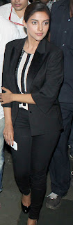 Asin looks like she means all business in her classic black pant suit.