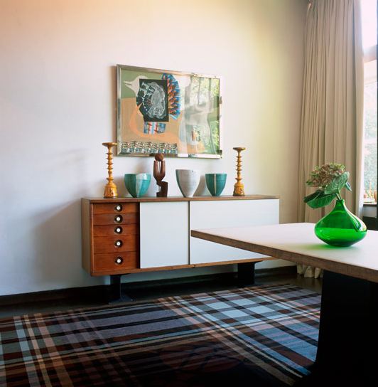 Living room with Vivienne Westwood plaid rug, a modern wall console and a table