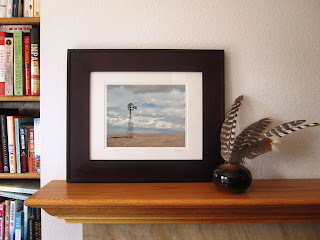 A western prairie photo of a windmill on the high plains of Colorado surrounded by grasslands. Pawnee National Grassland, Colorado