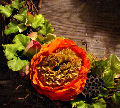 A twelve inch grape vine wreath with orange ranunculus my favorite flower 