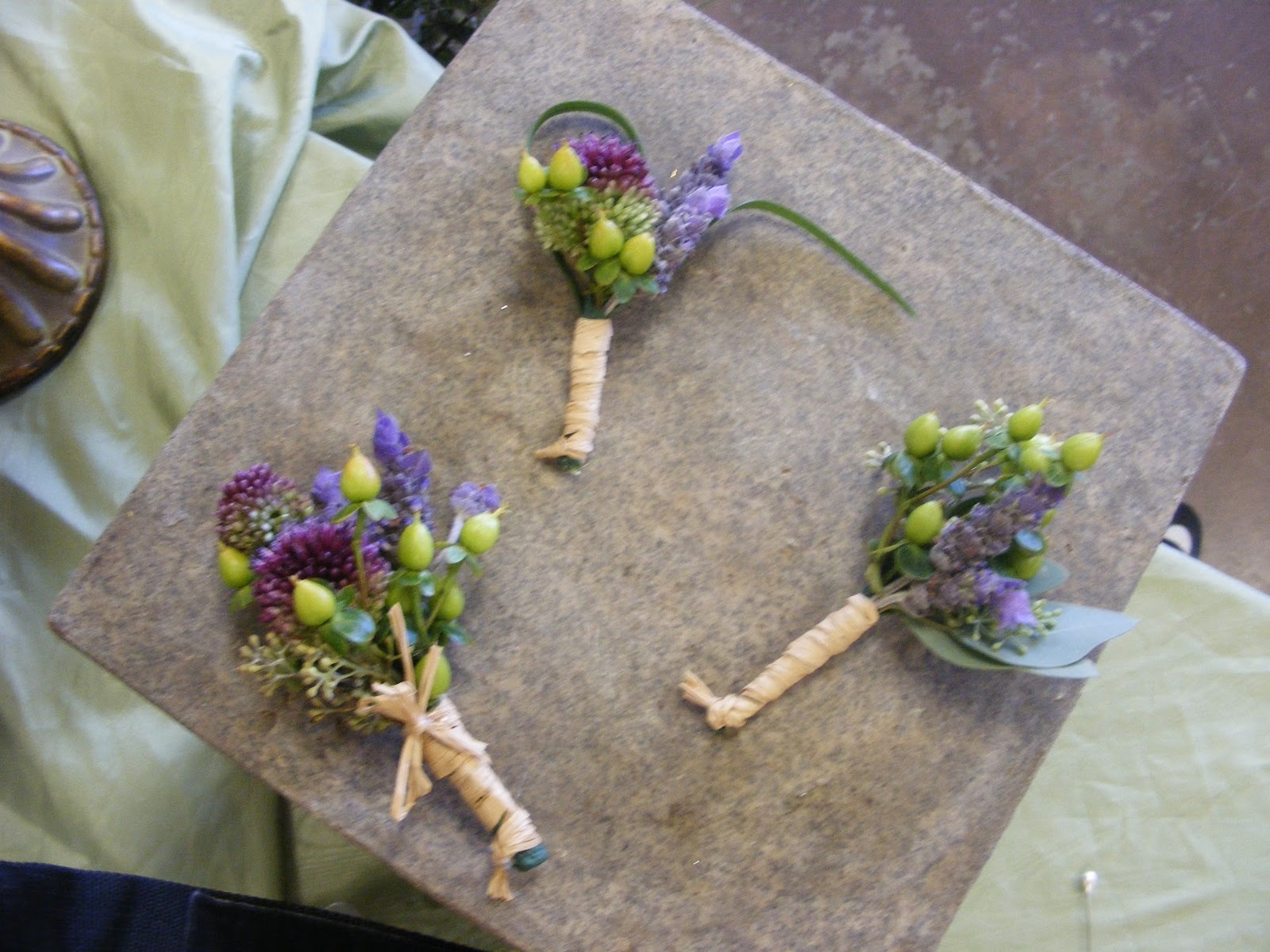 ... for his groomsmen. Each boutonniere was finished with a raffia wrap