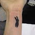 Little rabbit tattoo on hand