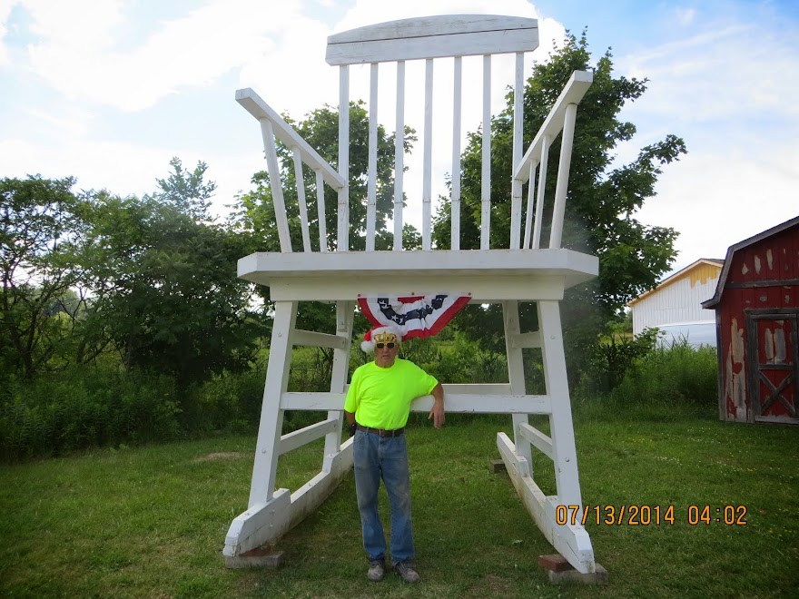 Here's Joe from Austinburg Ohio who built the world's largest rocking chair-Weird ?