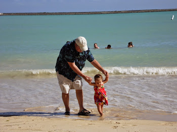 Grandpa and Rory walking the beach