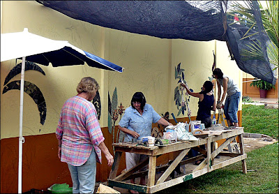 Ladies participating in the mosaic mural project start of the mosaic mural for CAIRA