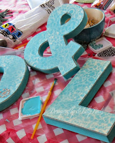 http://www.dragonflyandlilypads.com/2015/05/denim-art-for-craft-room.html D, &, L, P, Adding Acrylic Turquoise pint to edge, Sharpie Marker Silver Metallic used to edge front of letters.
