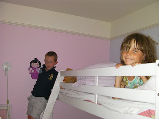 kids on bunk beds in pink room