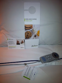 a remote control on a bed