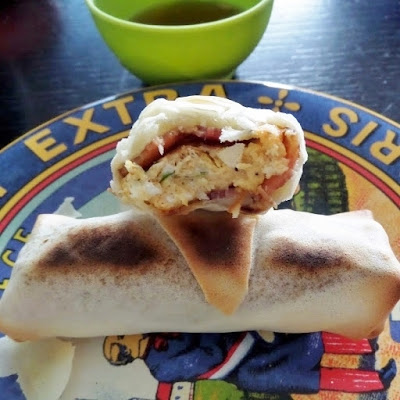 Bacon Egg and Cheese Spring Rolls:  Bacon, egg, and cheese baked in a crispy spring roll and then dipped in maple syrup.  A great breakfast for gameday.