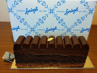 Layered chocolate confection with gold leaf from Sprüngli.
