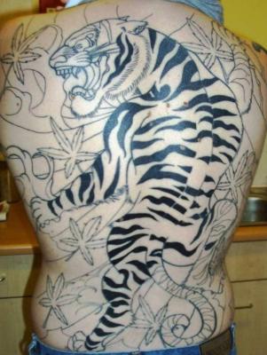 Sharing many aspects of symbolism with lion tattoos tiger tattoos are a
