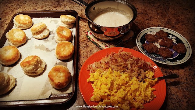Breakfast for supper, eggs, hashbrowns, sausage, gravy, biscuits