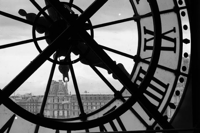 Louvre from Musee d'Orsay - Flotsam of the Mind view of the Louvre through the window clock at Musee d'Orsay