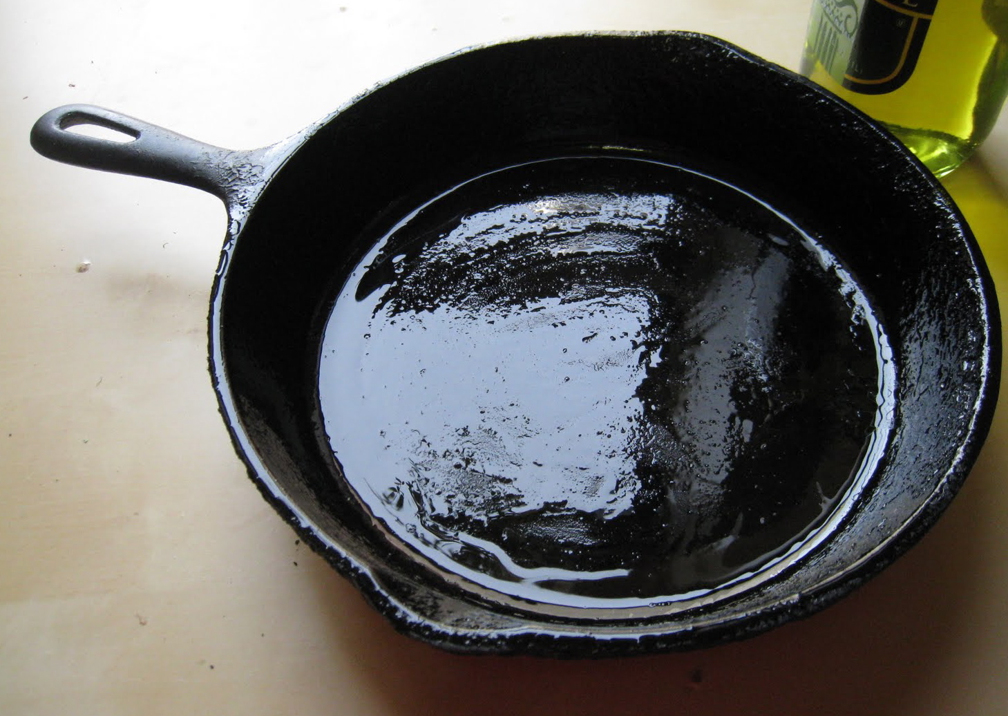 How do you season a cast iron frying pan?
