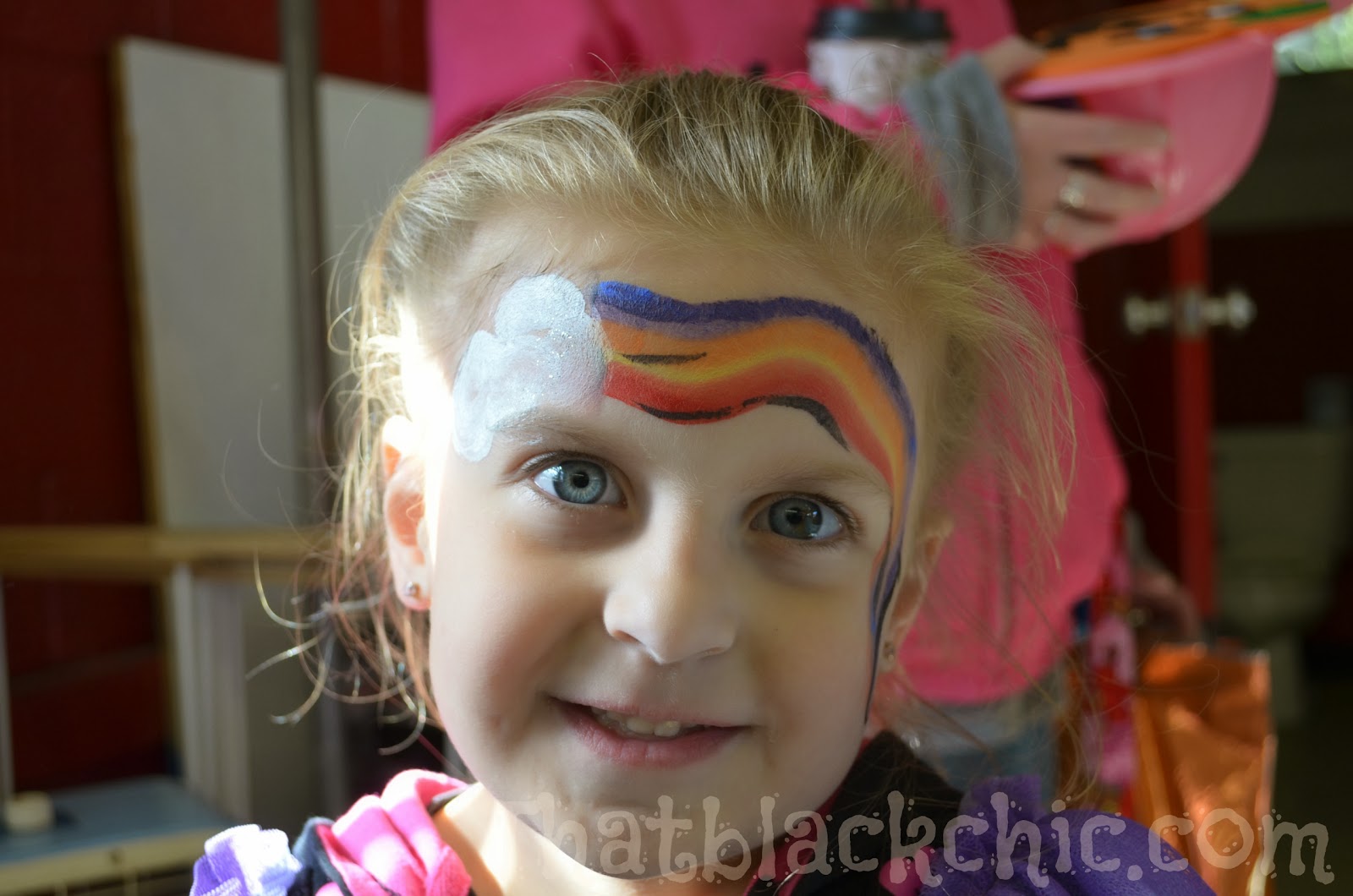 Giving back by volunteering Face Painting the kiddies That Black Chic