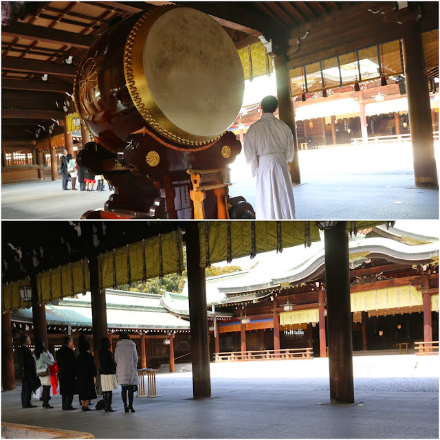 The Japanese family pray after the drum hit at one of the Shrine Memorial Hall building in Meiji Shrine, Tokyo, Japan The Japanese family pray after the drum hit at one of the Shrine Memorial Hall building in Meiji Shrine, Tokyo, Japan