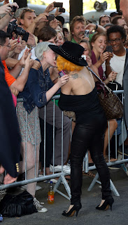 Lady Gaga kissing a fan