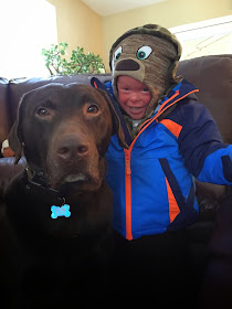 Evan, who has Harlequin Ichthyosis, with his dog Bruli