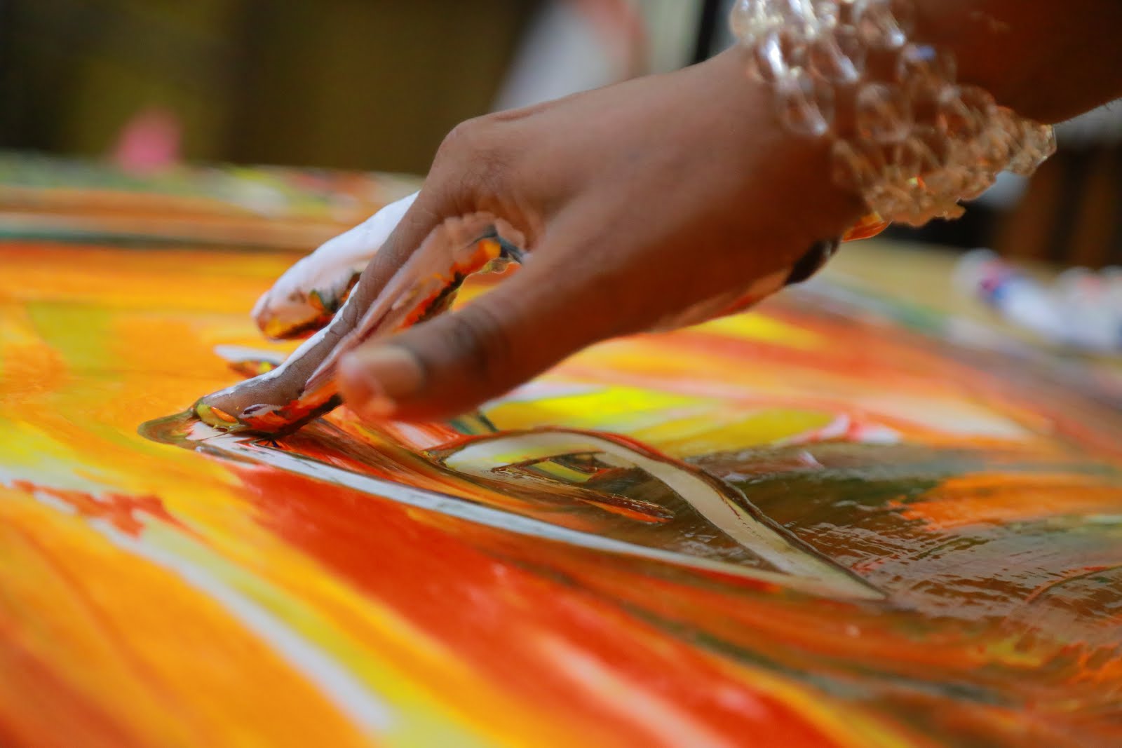 Parijoy Saha making a painting.