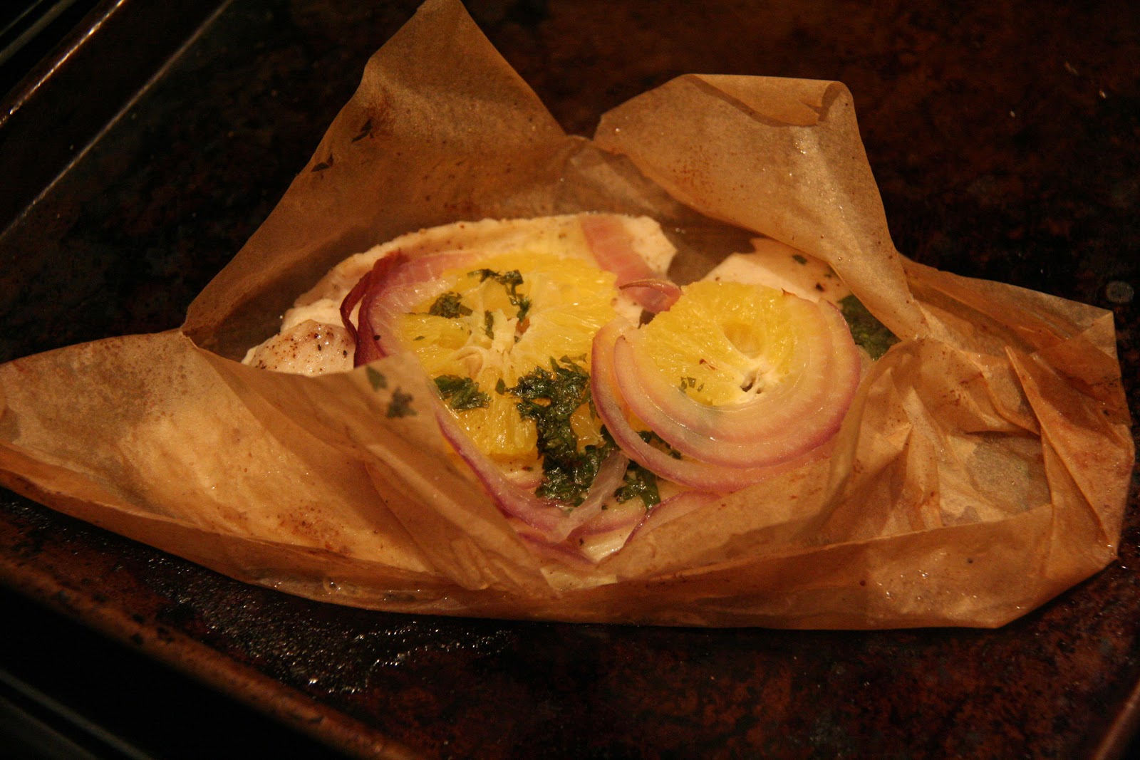 Tilapia En Papillote with Orange, Red Onion, and a Cilantro Compound