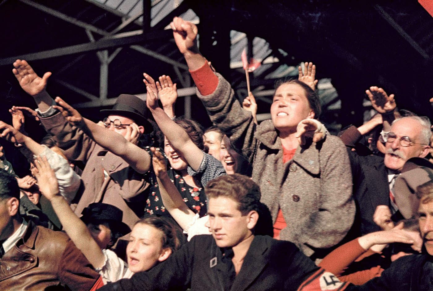 Crowds cheering Adolf Hitler’s campaign to unite Austria and Germany, 1938.