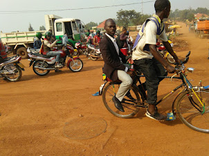 A passenger on a " Cycle Taxi  " in Kigali.