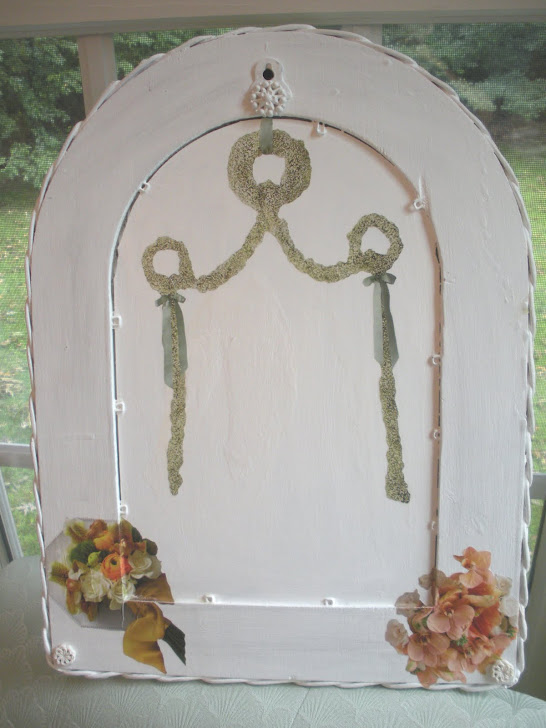 white wicker mirror (back decoupage with vintage buttons)