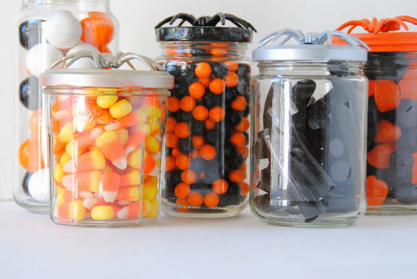 diy spider topped halloween candy jars