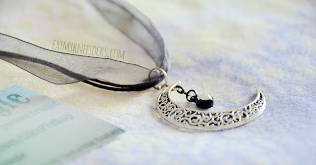 Poison Tragic Review: Nyctophilia Crescent Necklace More photos of the beautiful, grunge-inspired Nyctophilia Crescent moon cords-and-ribbon necklace from Poison Tragic.