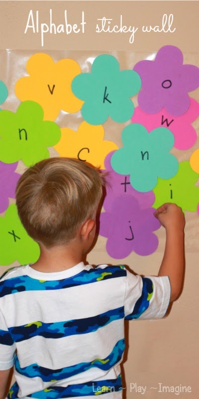 Create an alphabet sticky wall to work on letter recognition and letter sounds - preschool activity for spring
