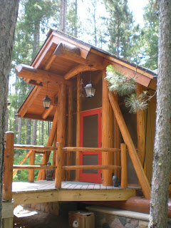 custom log and stone screen house by huismanconcepts.com