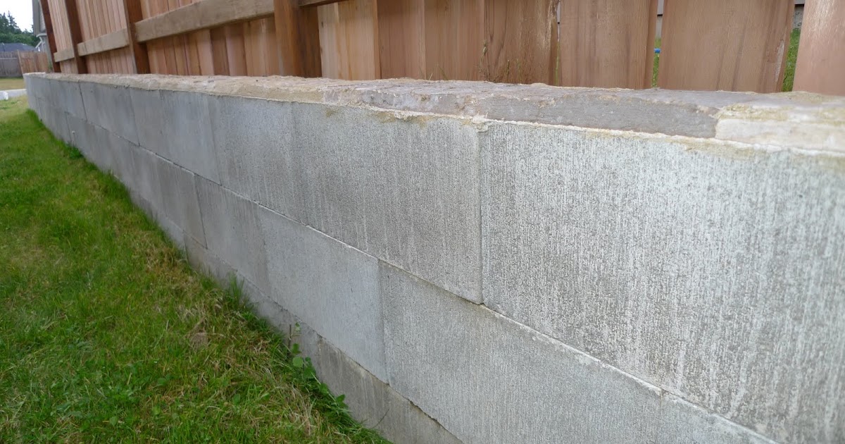 The Continuing Saga of the New Home Owner Dry Stacked Cinderblock Retaining wall complete with