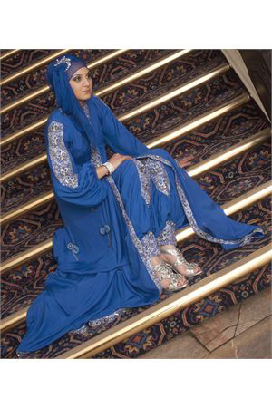 A long silk cobalt blue jilbab gown shaped to a princess cut silhouette