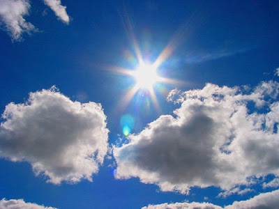 blue sky with sun and clouds