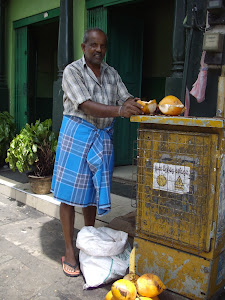 A Coconut seller on the streets of Kandy.