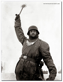 German soldier directs German war machines near Moscow. Winter 1941