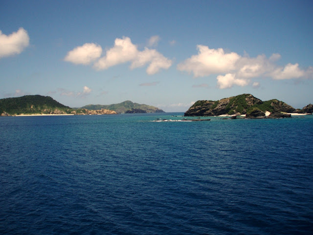 Islands and Deep Blue Water dark blue water and green islands