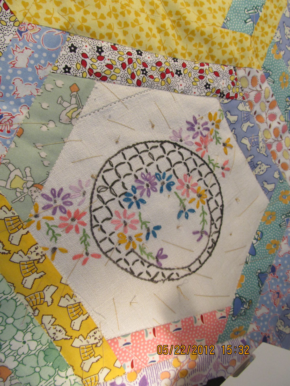 Applique and more Embroidered quilt topper