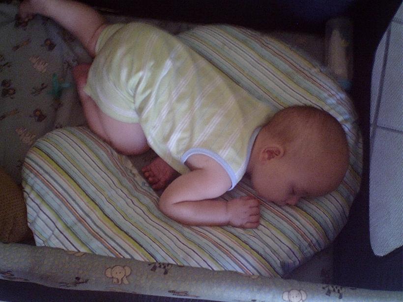 Exhausted Baby Sleeping on Boppy Pillow