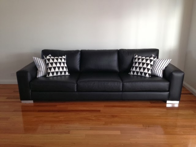 B is building a house: What style ottoman to go with our black leather