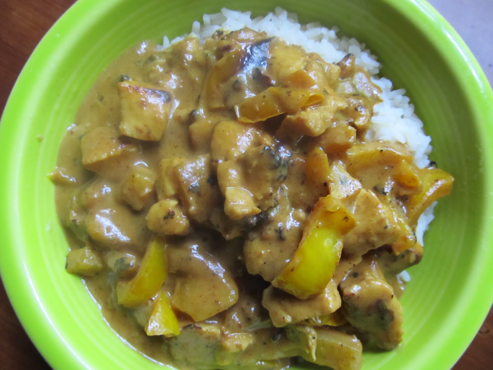 durhamonthecheap Chicken with creamy peanut butter / curry sauce over rice