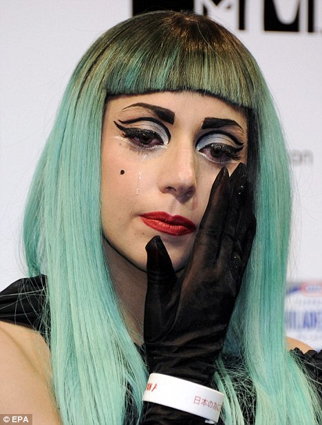 An emotional Lady Gaga wipes away tears as she remembers Japanese earthquake victims