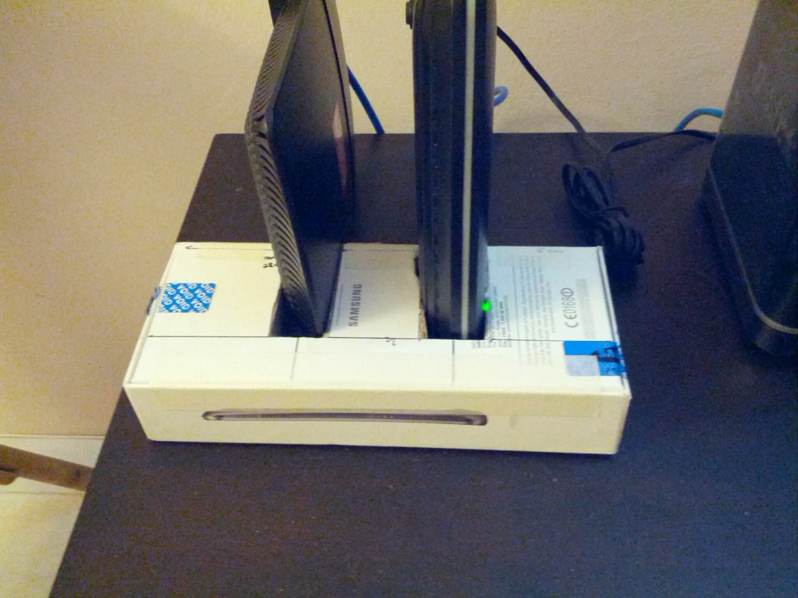 Make a vertical stand for your modem and router to save some table space