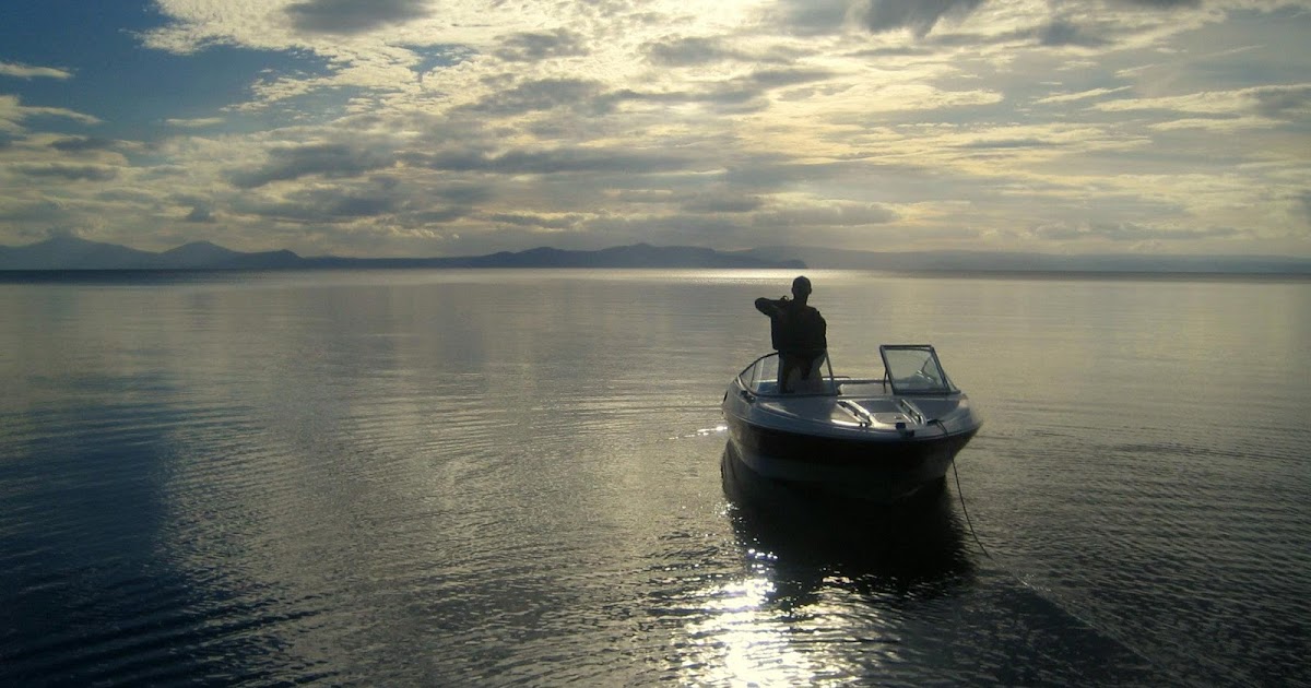 A Man and His Motorboat Being Traveler
