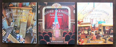 Three Mouse Mansion children's books on display on a table top.